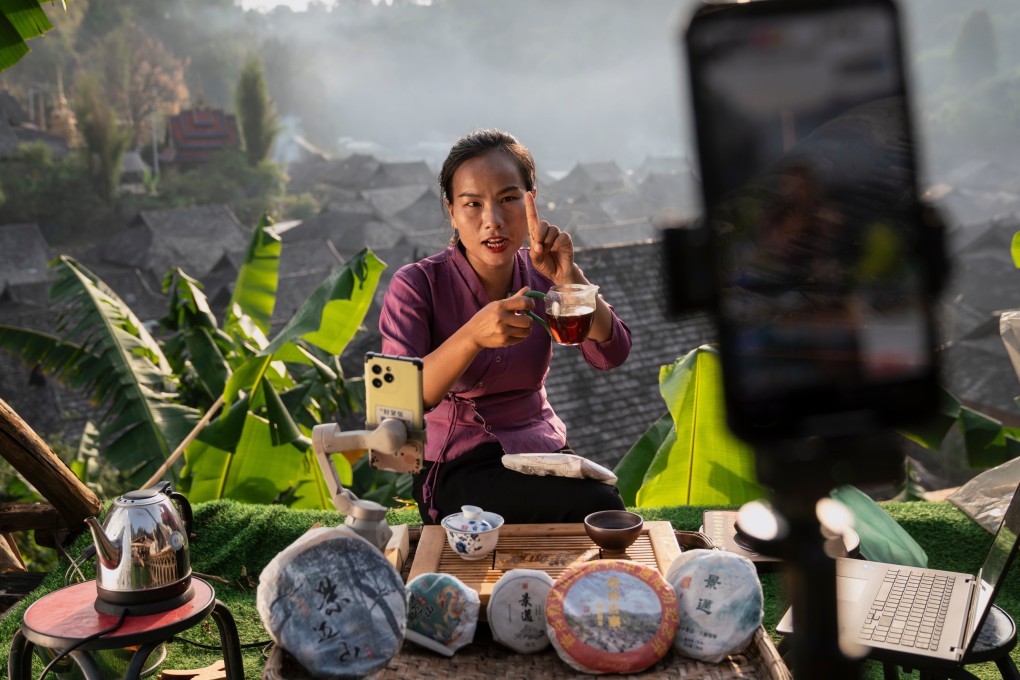Tea grower Ai Yong from the Dai indigenous community hosts a live stream, describing the taste and aroma of her Puer to enthusiasts across China. As Jingmai Mountain’s tea continues to fetch high prices, some residents of the remote area in southwestern China’s Yunnan province have found new ways to connect with consumers. Photo: Justin Jin