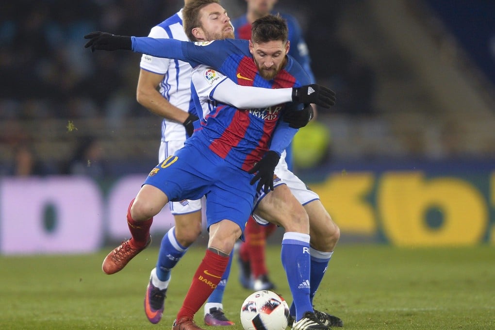 Asier Illarramendi (left), then with Real Sociedad, grappling with Barcelona’s Lionel Messi in a 2017 Spanish King’s Cup match. Photo: Reuters