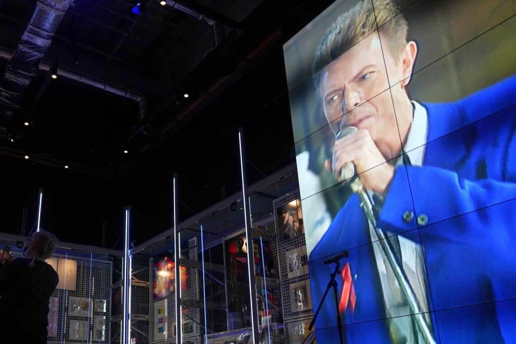 Visitors take photos at the David Bowie Centre, a new archive at the V&A East Storehouse in London on September 10, 2025, ahead of its public opening on Saturday. Photo: AP
