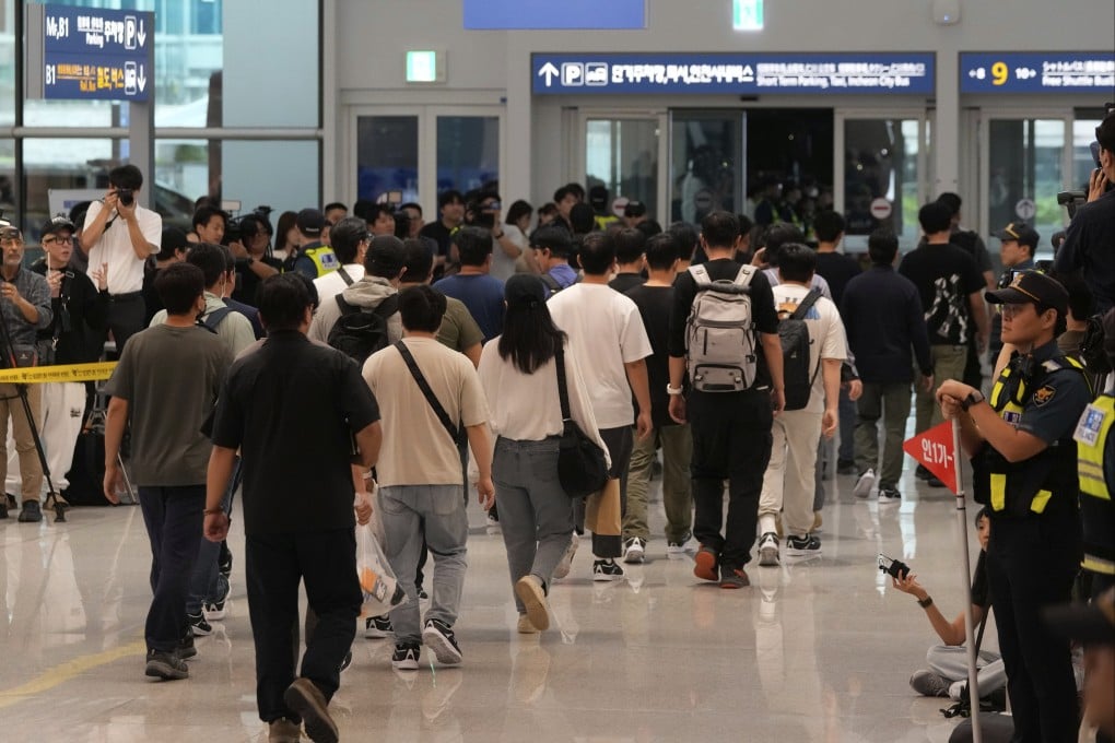 South Korean workers released after days of detention in the US arrive at Incheon airport on Friday. Photo: AP