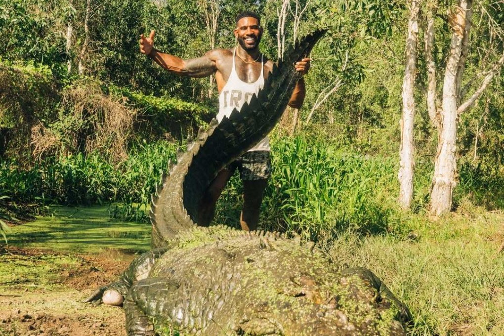 US influencer Mike Holston poses with a crocodile in Australia. Photo: Instagram/therealtarzann