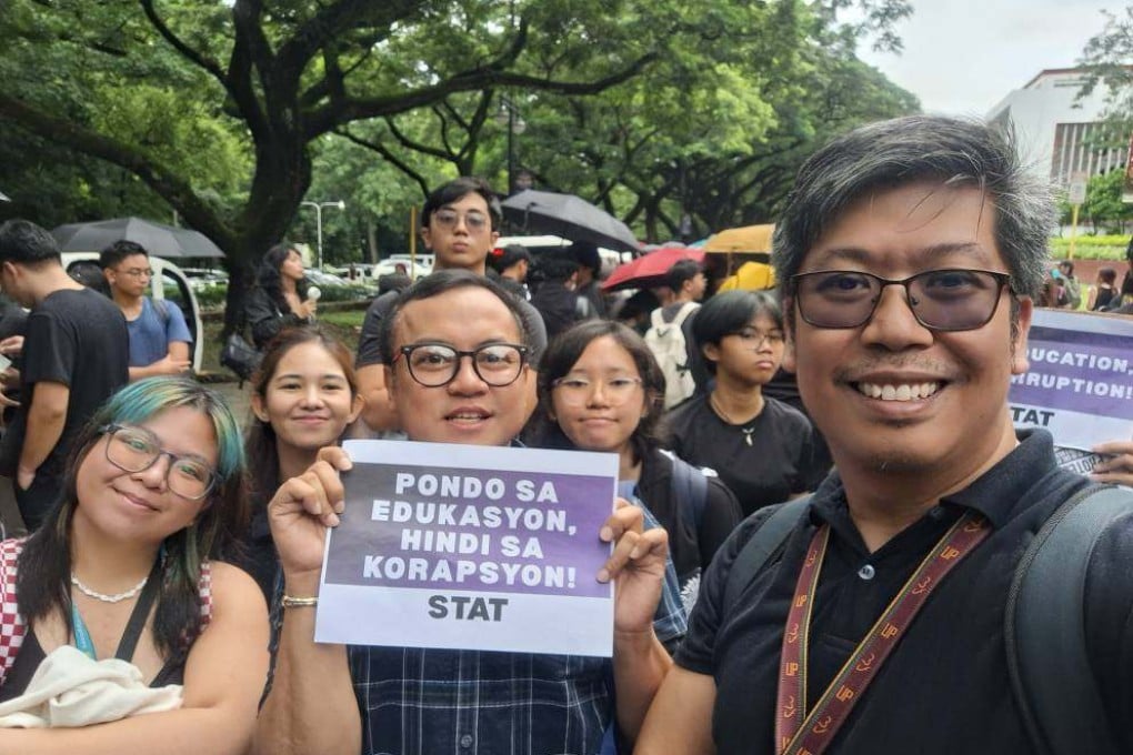 Raymond Macapagal poses with his students at Friday’s walkout at the University of the Philippines. Photo: Raymond Macapagal