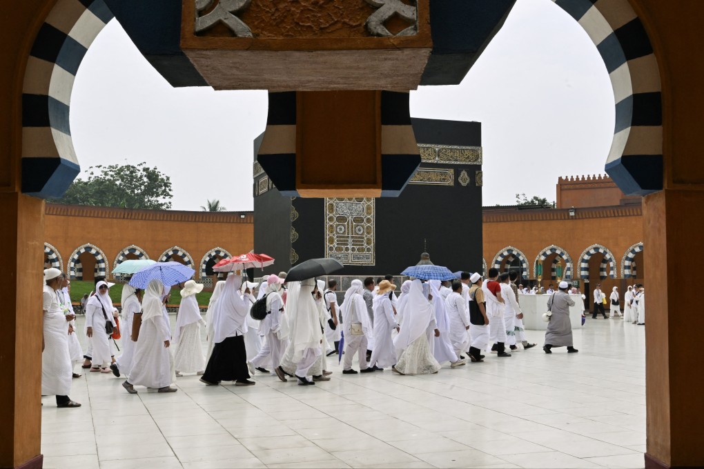 Muslims circumambulate around a replica of the Kaaba, Islam’s holiest shrine, at a training centre in Indonesia where pilgrims train to perform Haj rituals. Photo: AFP