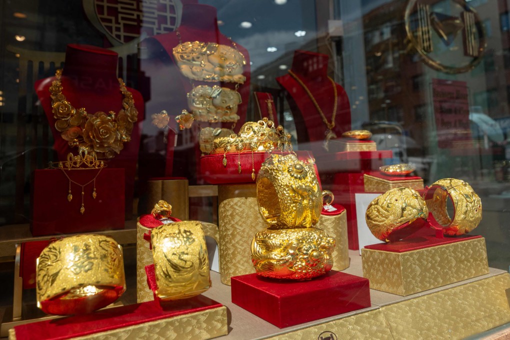 Gold jewellery is displayed in a window in New York on September 8. The price of gold is leaping to record highs nearly every day. Photo: AFP