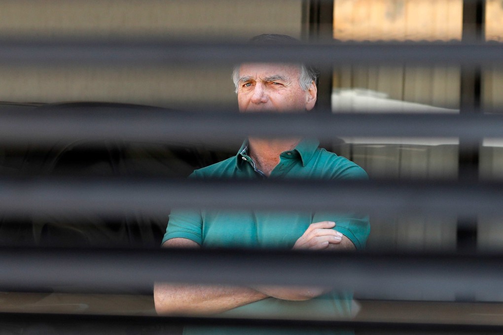 Former Brazilian president Jair Bolsonaro at the garage of his residence in Brasilia on Thursday. Photo: AFP