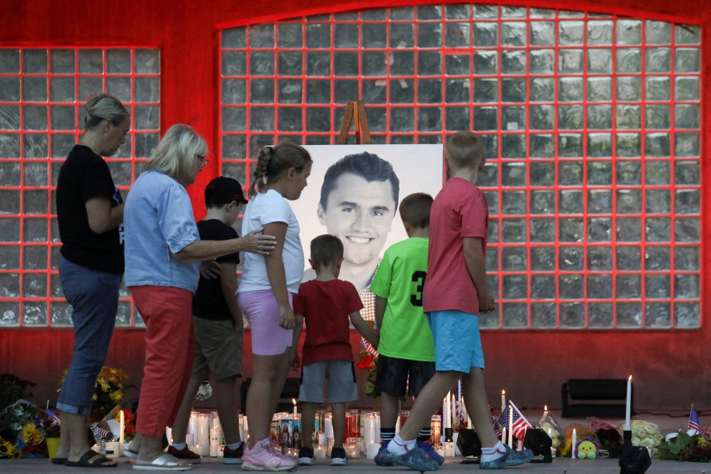 People, including children, attend a vigil in Utah after the right-wing activist and commentator, Charlie Kirk, an ally of US President Donald Trump, was shot dead during an event at Utah Valley University. Photo: Reuters