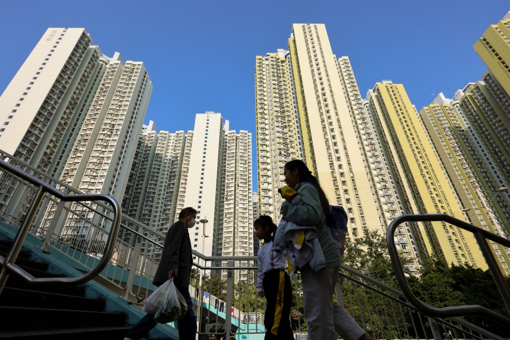 People walk past Un Chau Estate in Cheung Sha Wan. Photo: Jelly Tse