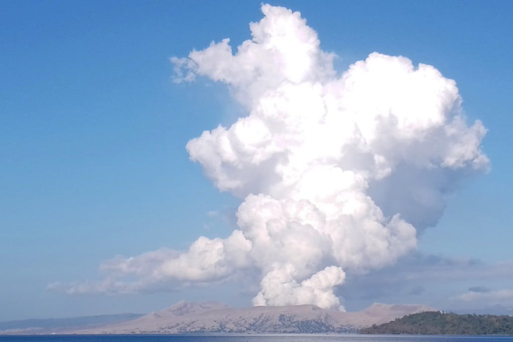 Taal Volcano spews white steam and ash as seen from Balete, Batangas province, in March 2022. Photo: AP