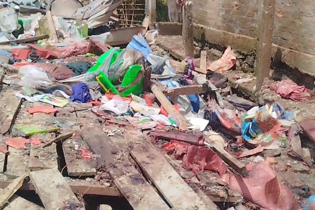 Debris lays scattered at the site of a school and dormitory following what is believed to have been an airstrike by the Myanmar military. Photo: Handout video screenshot, via Reuters