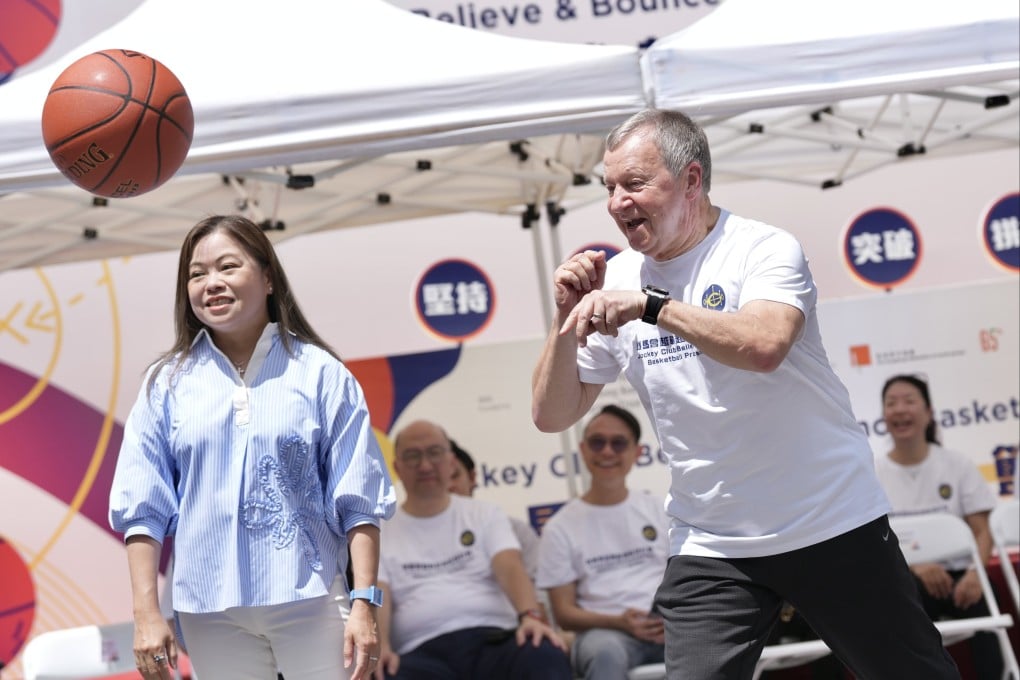Secretary for Culture, Sports and Tourism Rosanna Law (left) and Winfried Engelbrecht-Bresges, the Jockey Club CEO, take part in a basketball demonstration during the announcement at Tai Kwun. Photo: Karma Lo