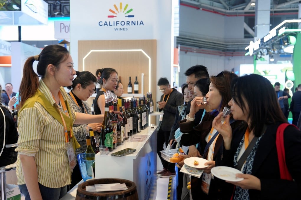 Visitors try American wine at the California Wines booth during last year’s China International Import Expo (CIIE) in Shanghai/ Photo: Reuters
