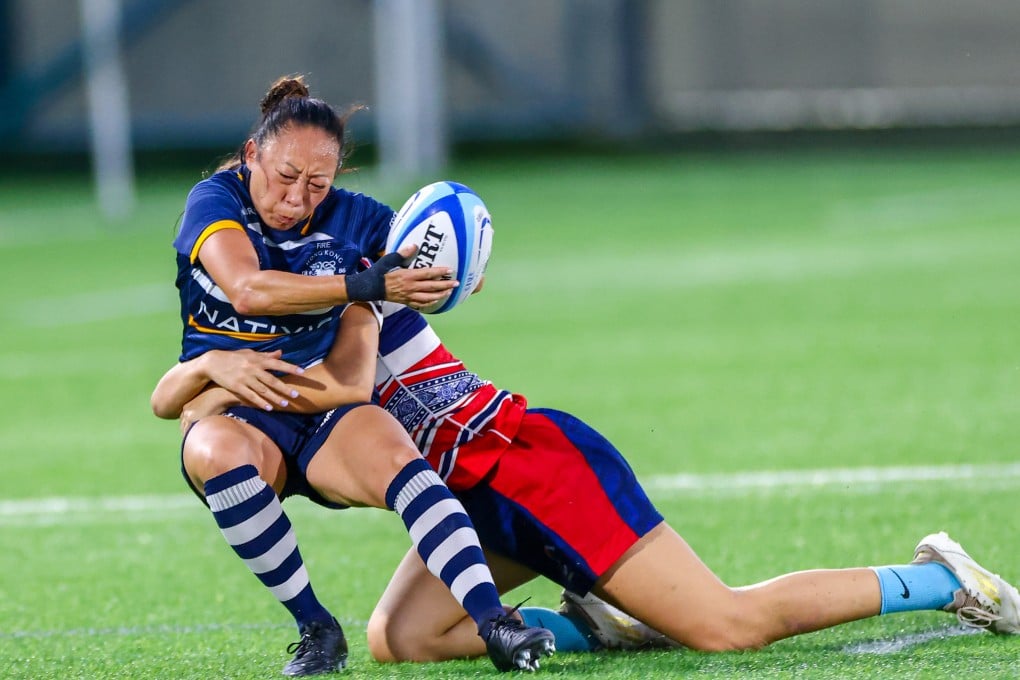 Han-Mi got to experience plenty of first playing for Football Club on Saturday, including getting tackled. Photo: Dickson Lee