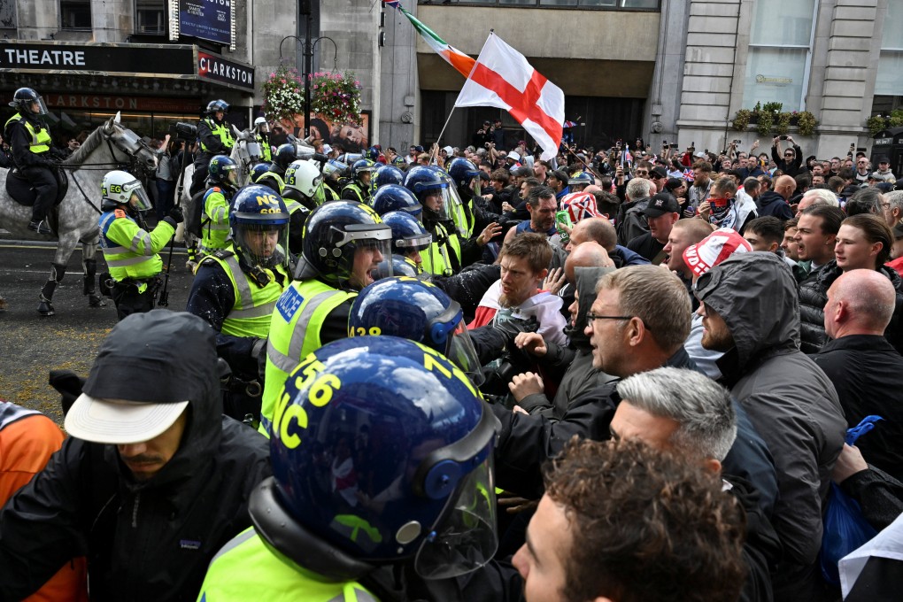 Police officers clash with supporters of British anti-immigration activist Tommy Robinson, during a demonstration in London on Saturday. Photo: Reuters