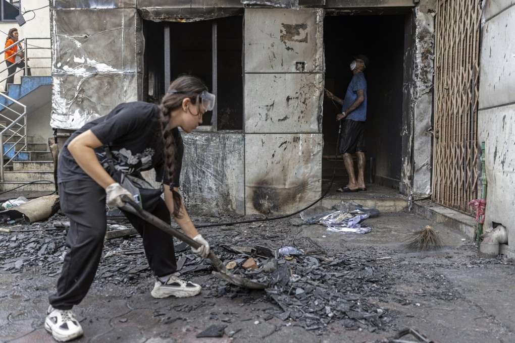 Nepalese Gen Z volunteers clean up a police station in Kathmandu on Saturday, after days of tumultuous protests. Photo: EPA