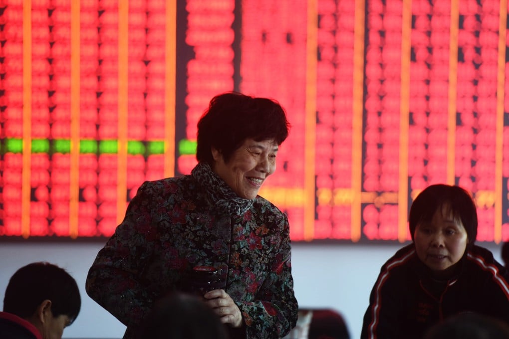 An investor reacts to gains at a brokerage house in Hangzhou, in east China’s Zhejiang province. Photo: Shutterstock