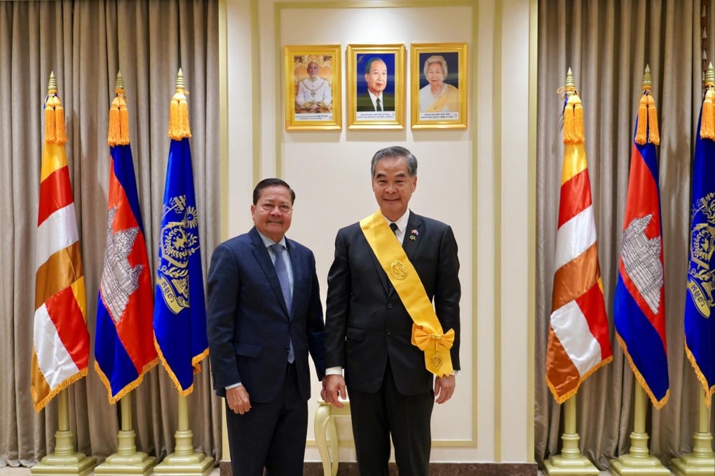 Cambodian Deputy Prime Minister Neth Savoeun (right) awarded CY Leung the Knight Grand Officer rank of the Royal Order of Monisaraphon. Photo: Handout
