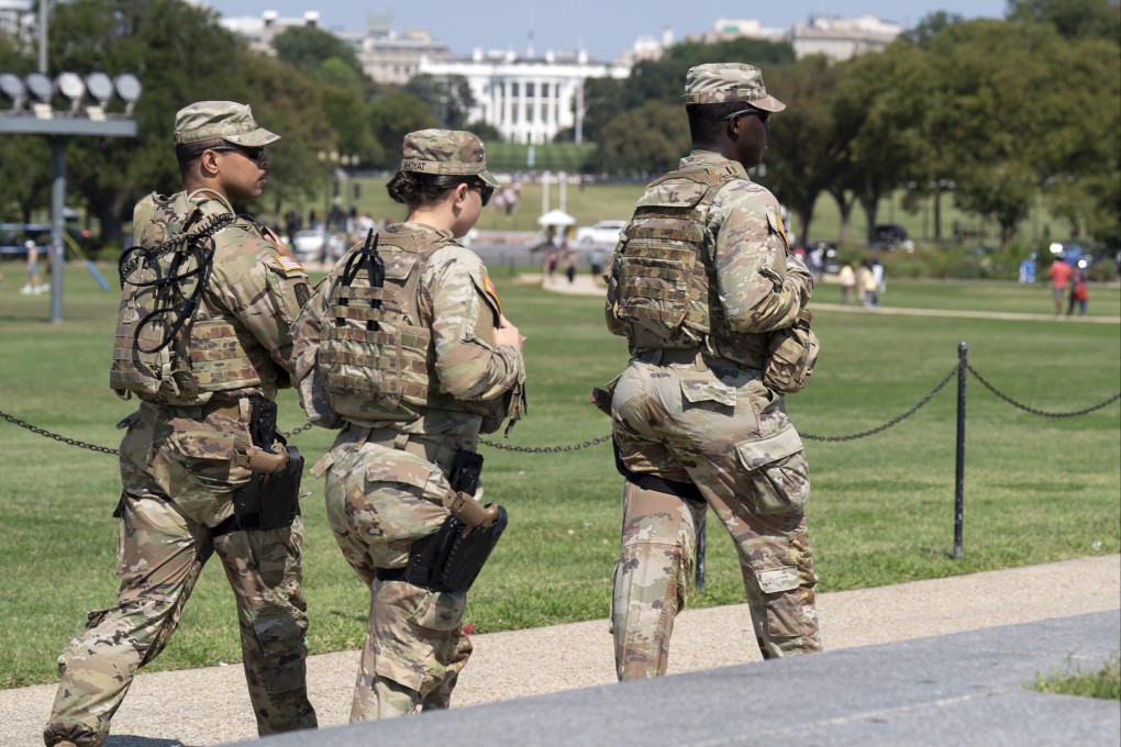 National Guard troops patrol the National Mall in Washington on Sunday. Photo: AP