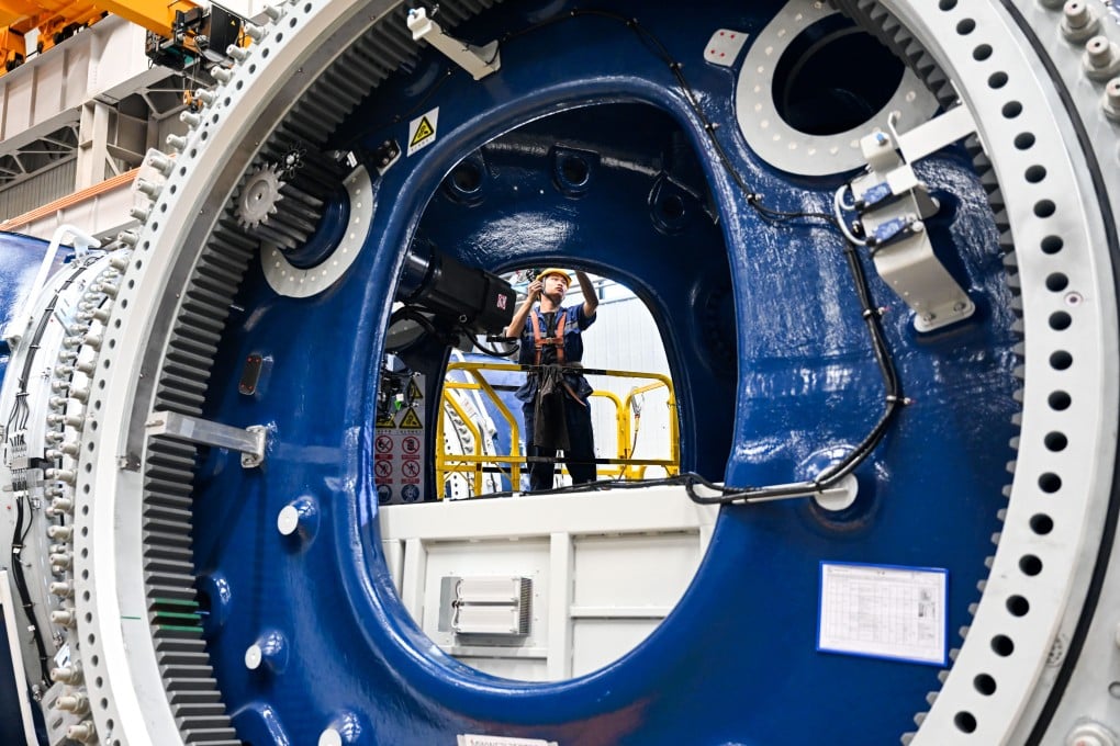 A worker stands inside a wind turbine at Mingyang New Energy Intelligent Manufacturing Industrial Park in Baotou, in north China’s Inner Mongolia Autonomous Region, on July 29, 2025. Photo: Xinhua