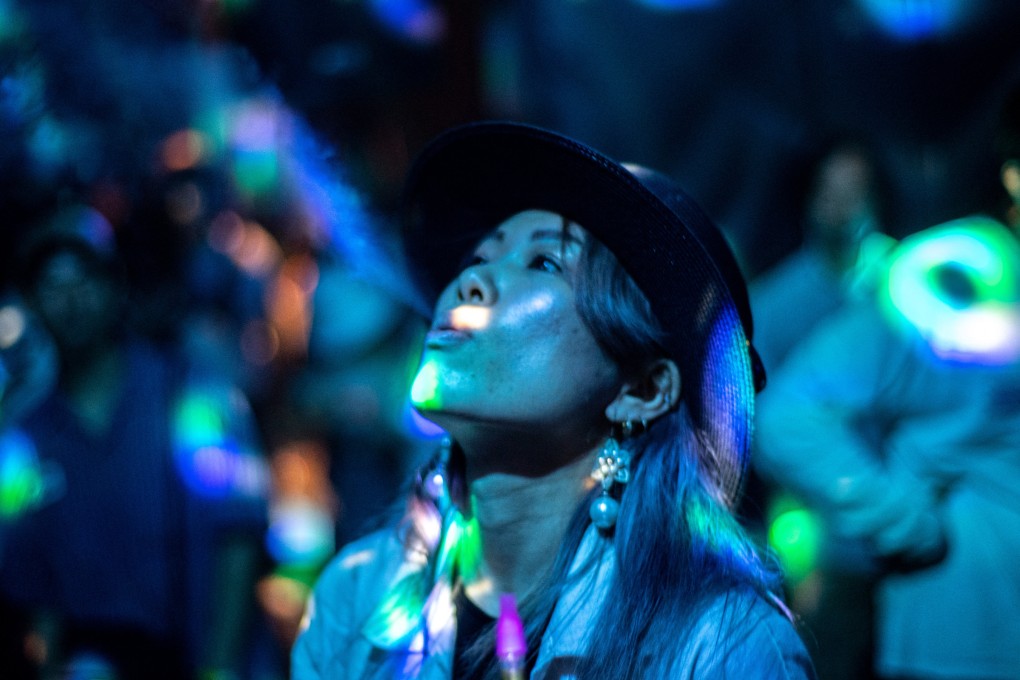 A Japanese woman uses a vape at an event in Tokyo. Photo: AFP
