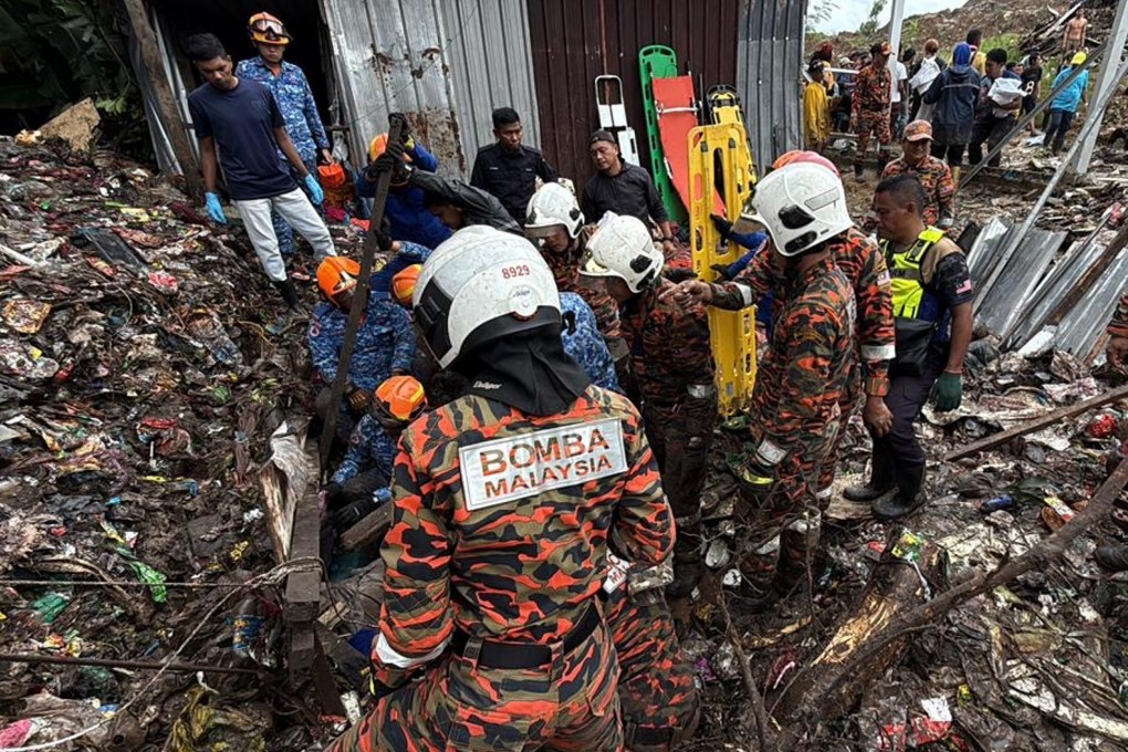 Rescuers work at a village hit by a storm near Kota Kinabalu in Malaysia’s Sabah state on Monday. Photo: Handout via Xinhua