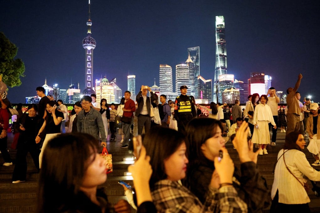 Crowds of tourists throng the Bund in central Shanghai during the May Day public holiday earlier this year. China’s travel sector is seeing a strong uptick in demand as consumers increasingly prioritise spending on services and cultural experiences. Photo: Reuters