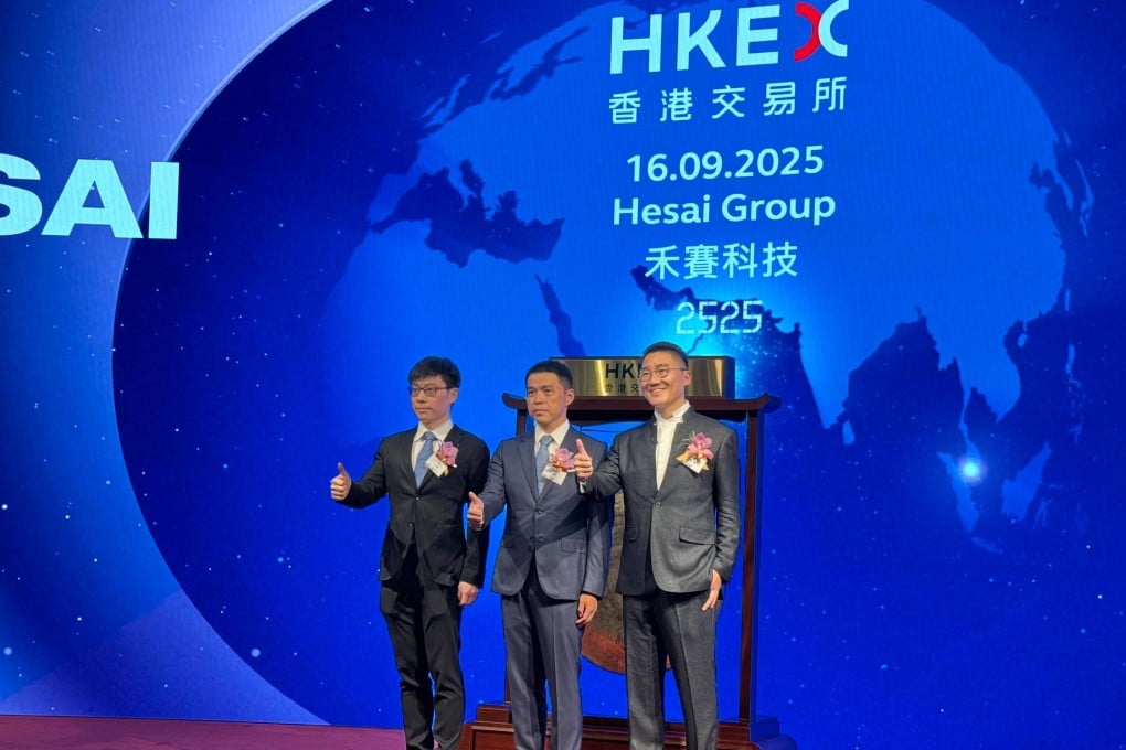 (From left) Hesai’s co-founder and chief technology officer Xiang Shaoqing, co founder and chief scientist Sun Kai, and cofounder and CEO Li Yifan, at the Connect Hall of the Hong Kong stock exchange on September 16, 2025. Photo: Julie Zhang.