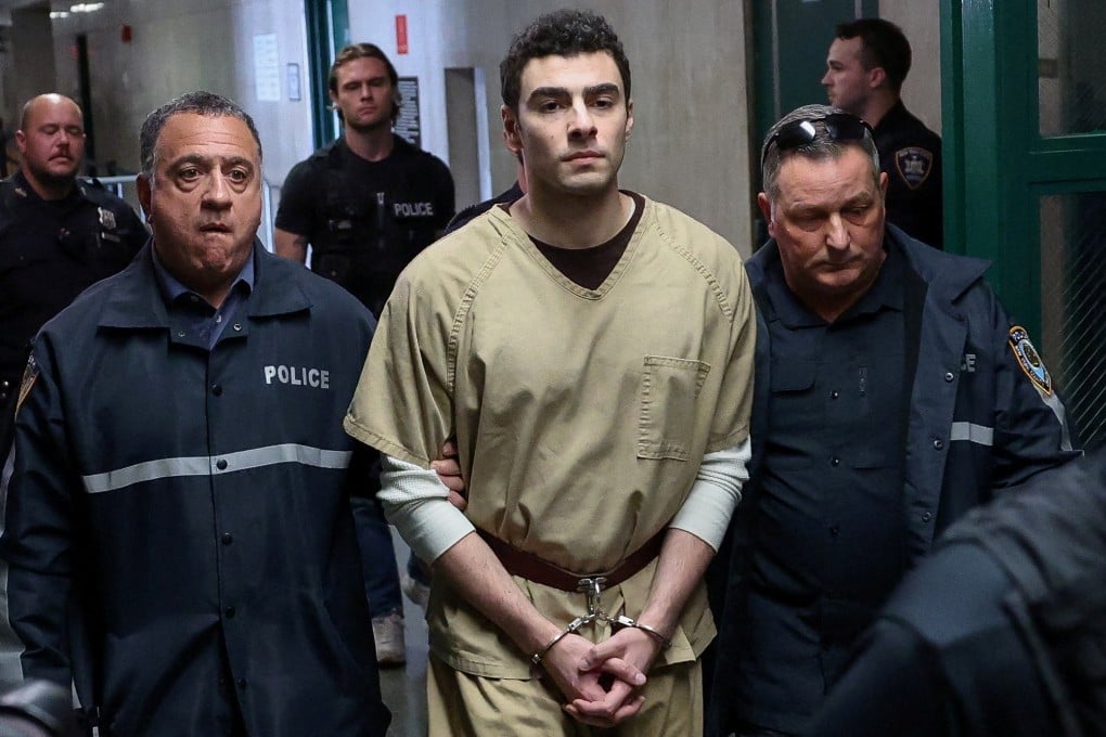 Luigi Mangione, the suspect in the killing of UnitedHealthcare chief executive Brian Thompson, is escorted by police officers at Manhattan Supreme Court on Tuesday. Photo: Reauters