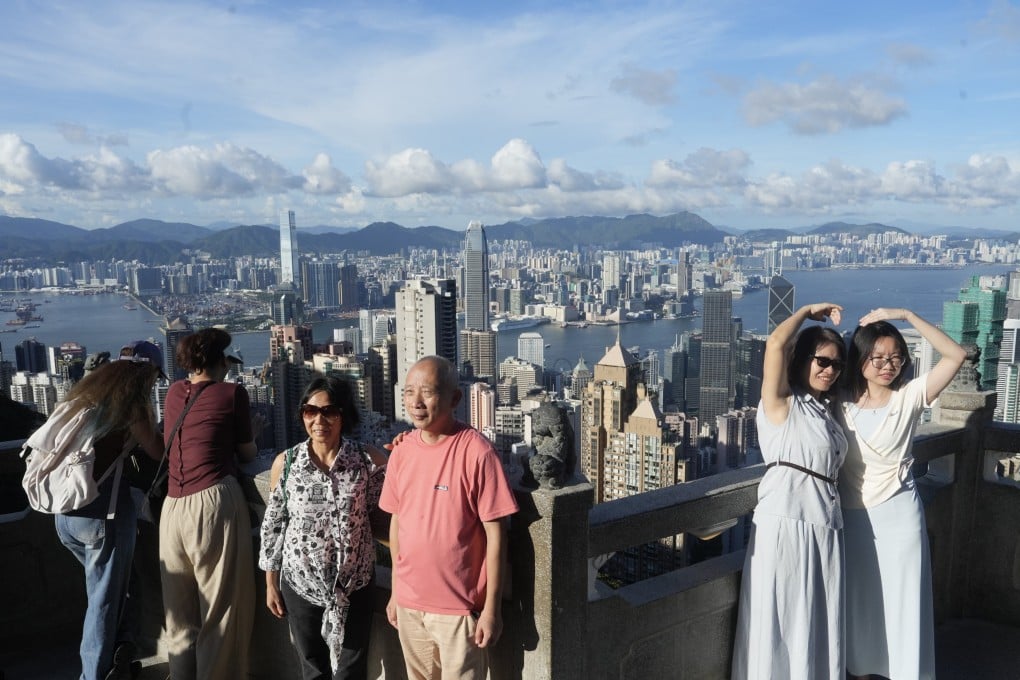 Tourists visit The Peak. A ceremony launching the new routes will be held next month, and students will be the first to try the tour, which includes crossing the border. Photo: Sun Yeung