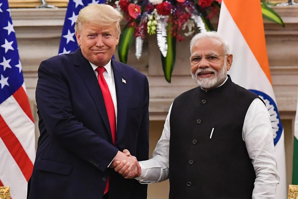 India’s Prime Minister Narendra Modi shakes hands with US President Donald Trump before a meeting in New Delhi in February 2020. Photo: TNS