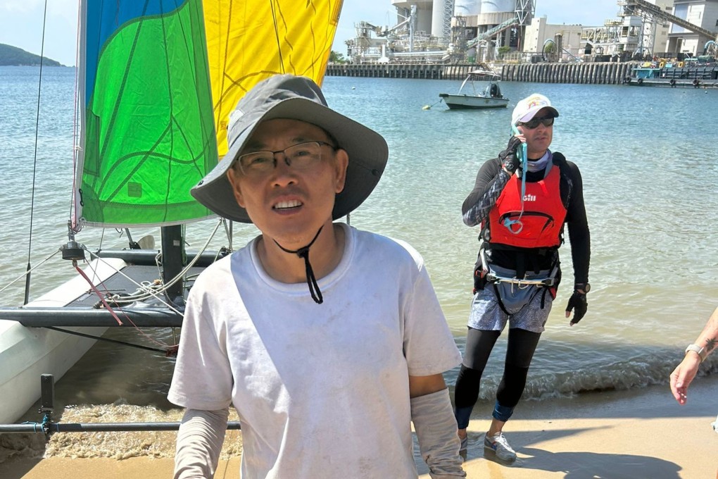 Zheng To, 52, from mainland China, was found on a Lamma Island beach by sailor Anton Aleshin (rear) after going missing for four days. Photo: Handout