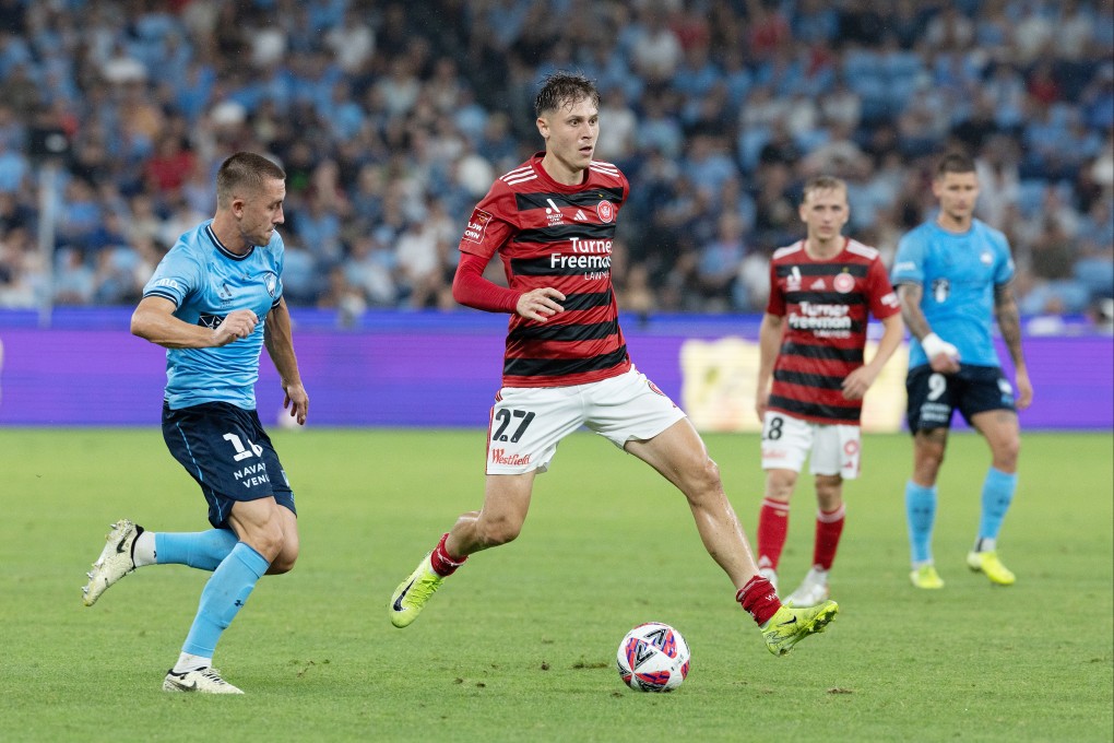 James Temelkovski (centre) in action for Western Sydney Wanderers against Sydney FC last season. Photo: Corbis via Getty Images