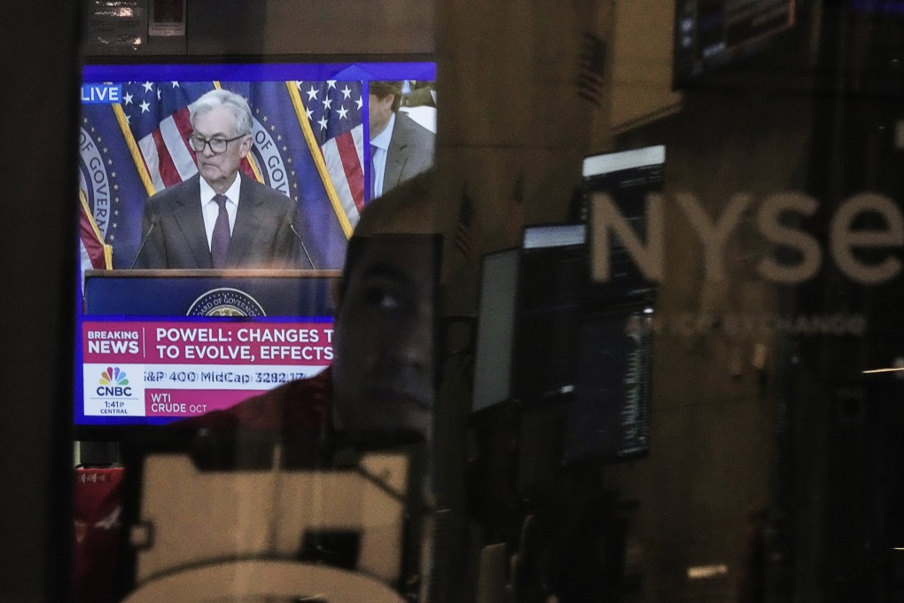 Federal Reserve Chair Jerome Powell’s news conference is displayed on a screen on the floor of the New York Stock Exchange on Wednesday. Photo: AP