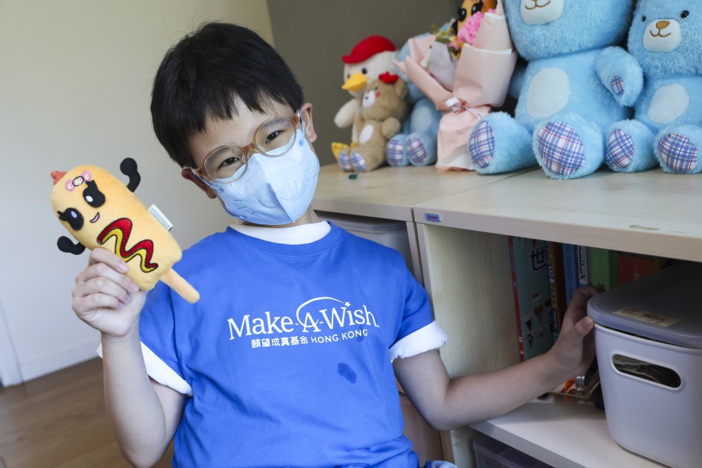 Sophie Chan, nine, holds a Corny Ketchy, a plush toy she designed with the help of children’s charity Make-A-Wish Hong Kong, and is distributing to inspire children to “never give up”. Photo: Edmond So