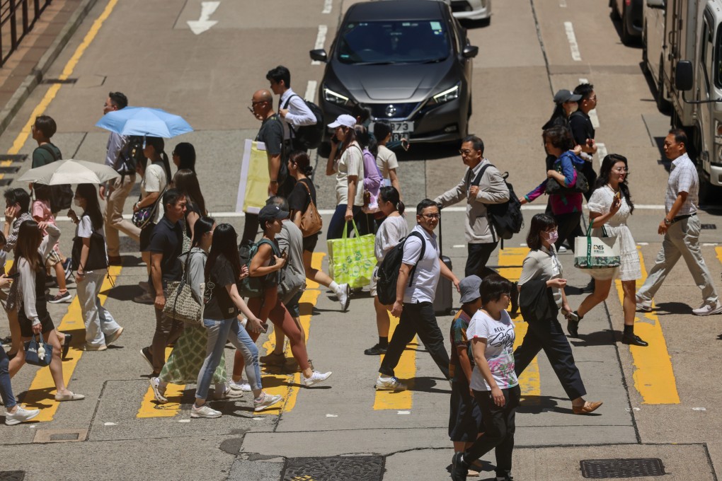 Pedestrians crossing a road in Tsim Sha Tsui on August 26, 2025. Photo: Jelly Tse