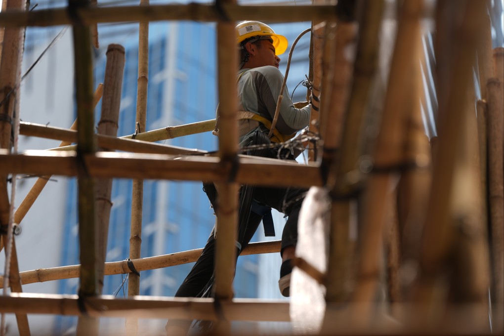 A scaffolding worker working on Causeway Place at Great George Street, in Causeway Bay, Hong Kong, on April 7. Photo: Sam Tsang