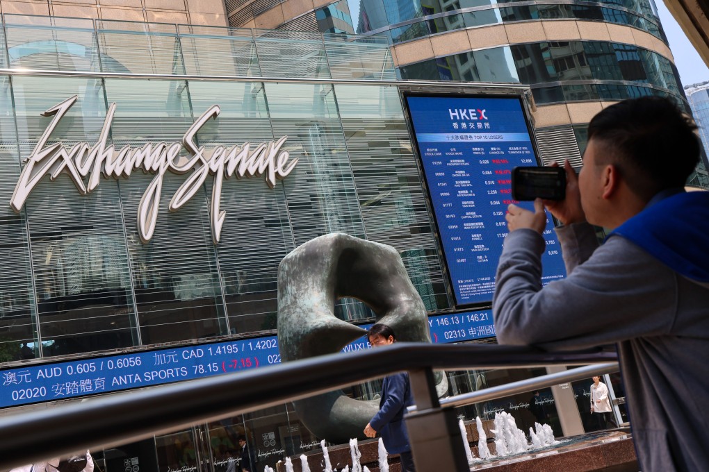 A man photographs Exchange Square in Central, where Hong Kong’s bourse operator is based, on April 7, 2025. Photo: Jelly Tse