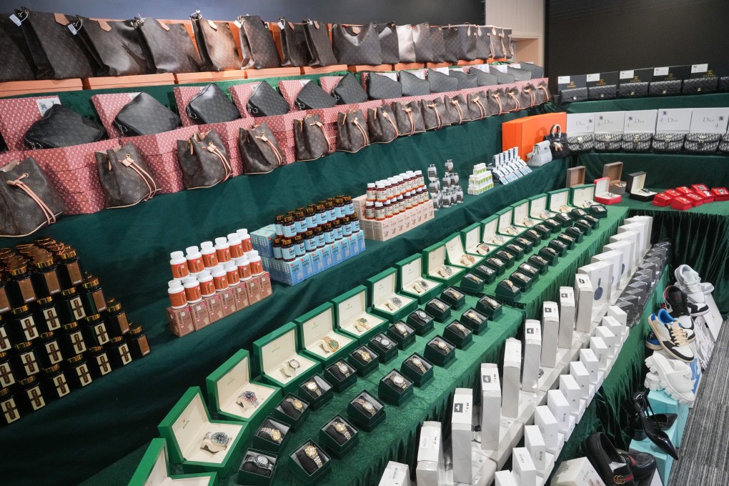 The seized items include counterfeit designer handbags and watches. Photo: May Tse