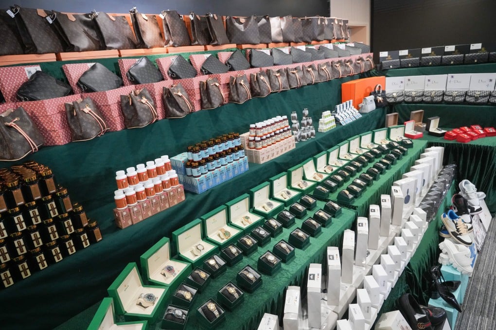 The seized items include counterfeit designer handbags and watches. Photo: May Tse