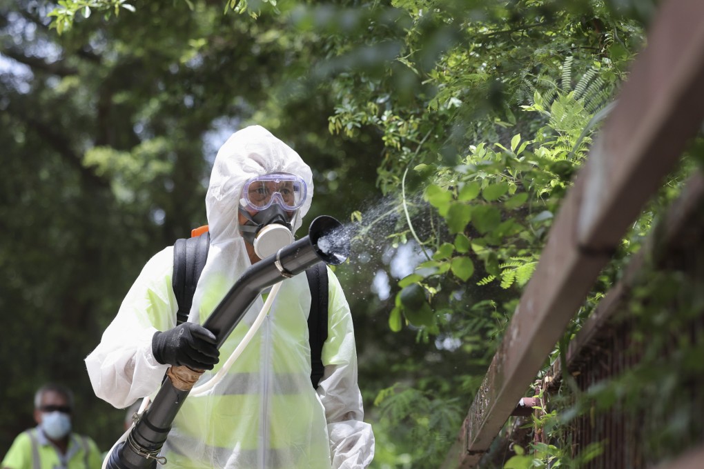 Workers from the Food and Environmental Hygiene Department carry out mosquito control. Photo: Karma Lo