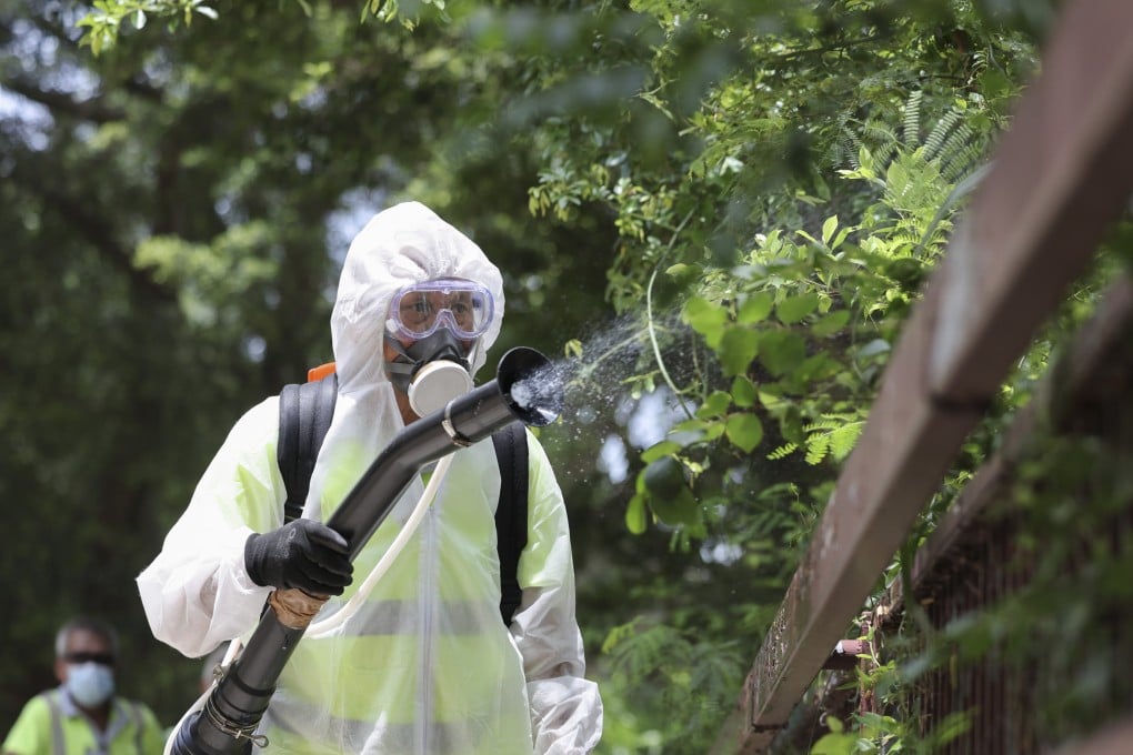 Workers from the Food and Environmental Hygiene Department carry out mosquito control. Photo: Karma Lo