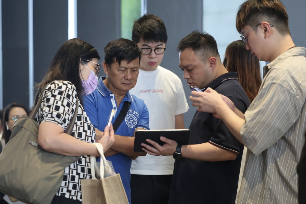 Potential buyers at the sales offices of Deep Water Pavilia in June. Photo: Edmond So
