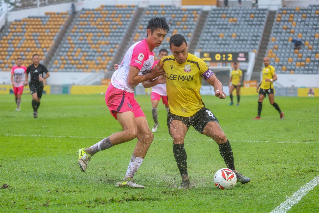 Lee Man’s Everton Camargo (right) battles for the ball with Kitchee’s Jason Kam at Mong Kok Stadium. Photo: Edmond So