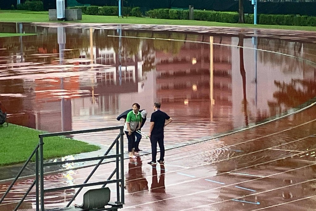 Waterlogging is evident during Kowloon City’s match against Tai Po at Sham Shui Po Sports Ground. Photo: Paul McNamara