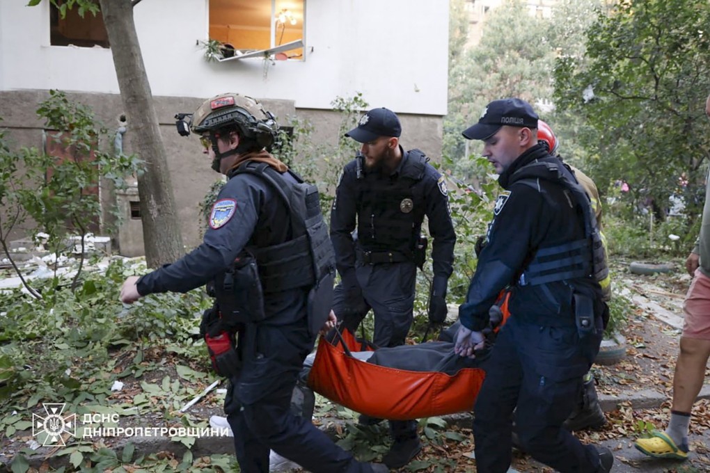 Ukrainian rescuers work at the site of a drone strike near a residential building in Dnipro, Ukraine, on Sunday. Photo: State Emergency Service Handout / EPA