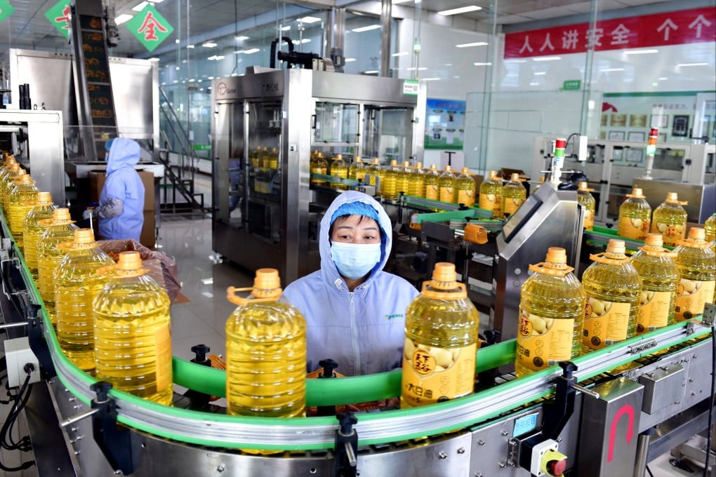 Workers keep an eye on the production line of a cooking oil factory in Boxing county, Shandong province, in November 2023. Photo: Xinhua