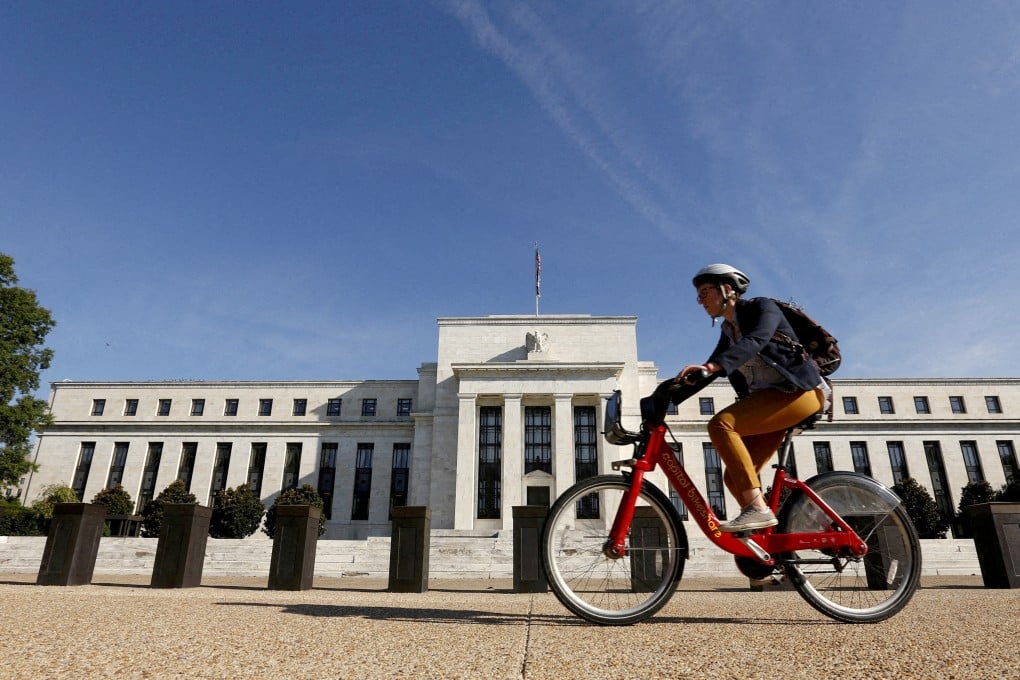 A cyclist passes the Federal Reserve headquarters in Washington on September 16, 2015. Photo: Reuters