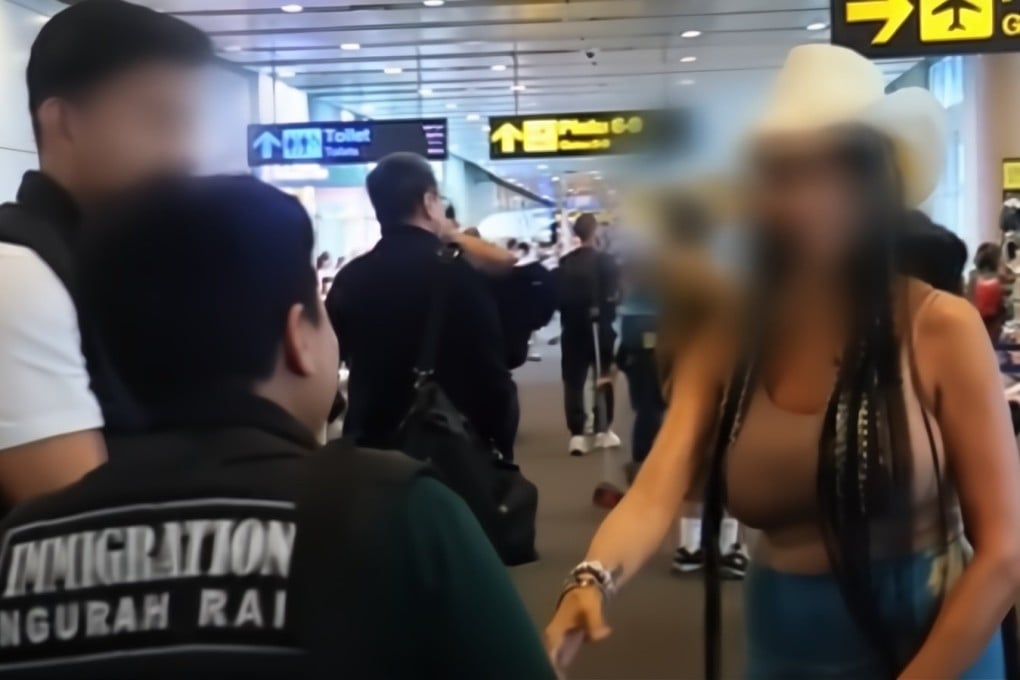 Screenshot from video posted to the official Instagram page of Bali’s immigration office showing officials escorting 44-year-old Jennelle Raynette Gordon, a self-styled “sexpert” from California, at Bali’s I Gusti Ngurah Rai International Airport. Photo: Instagram / imigrasibali Screenshot from video posted to the official Instagram page of Bali’s immigration office showing officials escorting 44-year-old Jennelle Raynette Gordon, a self-styled “sexpert” from California, at Bali’s I Gusti Ngurah Rai International Airport. Photo: Instagram / imigrasibali