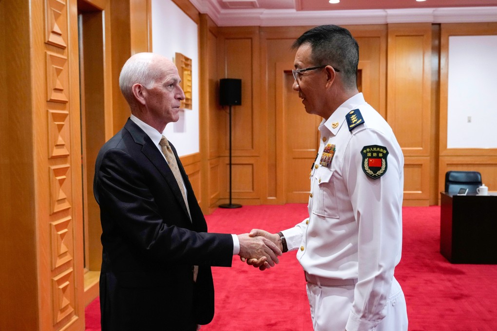 US congressman Adam Smith shakes hands with Chinese Defence Minister Dong Jun as he leads a bipartisan group of US lawmakers for a meeting at the defence ministry in Beijing on Monday. Photo: AP