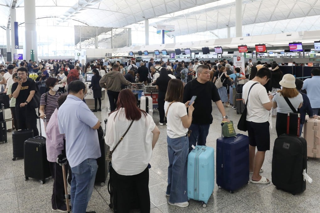 Passengers in the departure hall of Hong Kong International Airport on Tuesday. Many flights have been cancelled due to the approaching Super Typhoon Ragasa. Photo: Sun Yeung