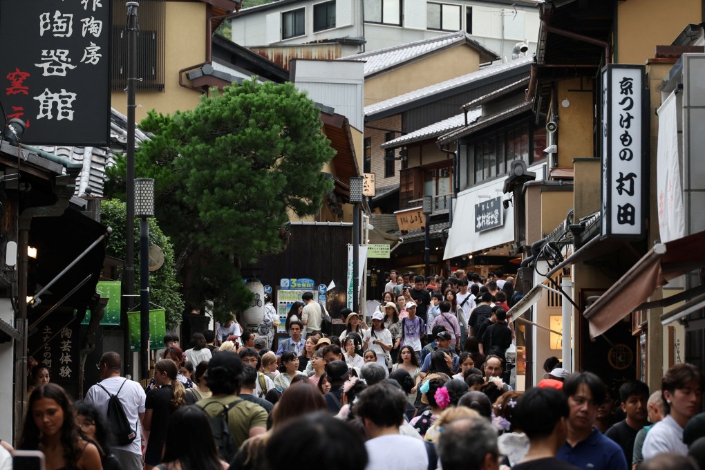 Visitors crowd a street leading to Kiyomizu Temple in Kyoto, Japan. A 2024 study by the Kyoto city government found that 56.06 million people visited over the course of the year. Photo: Reuters